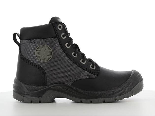 Chaussures de sécurité DAKAR S3 noires avec tige résistante à l'eau, semelle antidérapante et design robuste pour environnements exigeants.