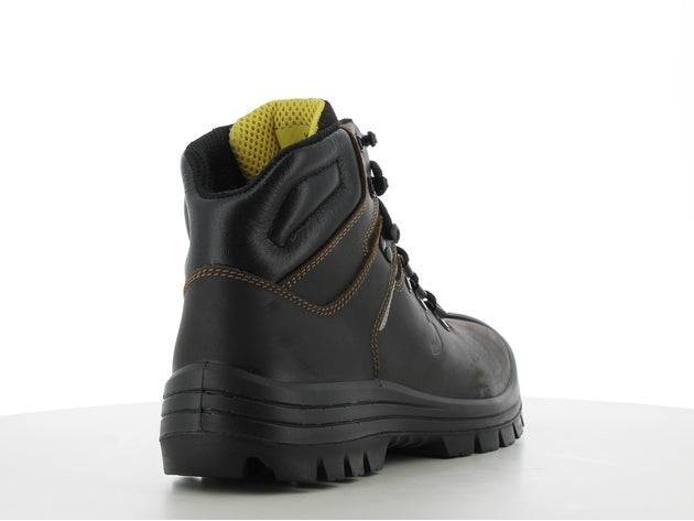 Chaussures de sécurité VESUVIO S3 MID en cuir noir, vue arrière droite avec col rembourré jaune et semelle épaisse antidérapante.
